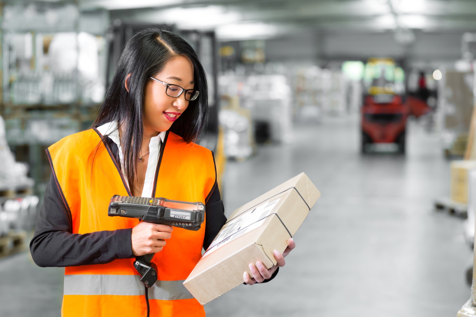 Warehouse worker scanning a package